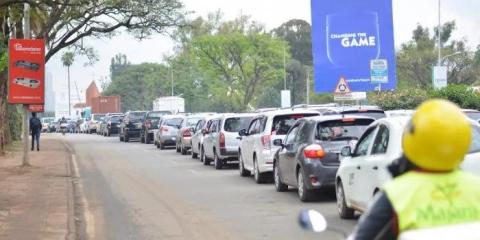 Vehicles in traffic along Uhuru Highway in Nairobi, Kenya.